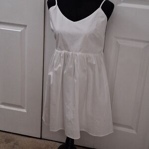 NWOT BP. White V Neck Baby Doll Mini Dress With A Tie Up Back  Size L
